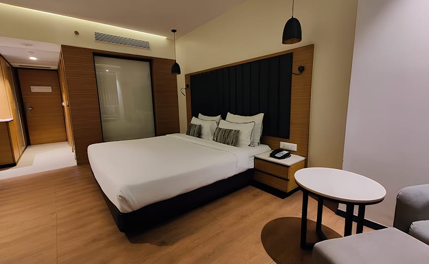 Premium king size bed room 1 at Novanta Jamshedpur with modern interiors and luxury amenities