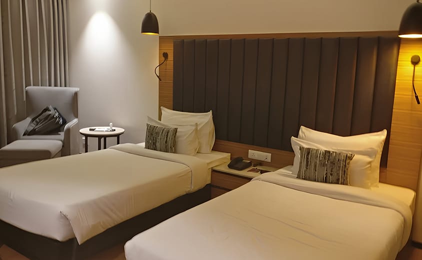 Premium twin bed room with modern facilities at Novanta Jamshedpur